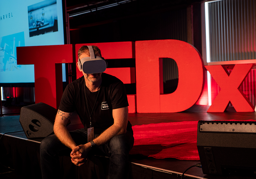 Promo shot wearing the Oculus Go on the TEDx stage